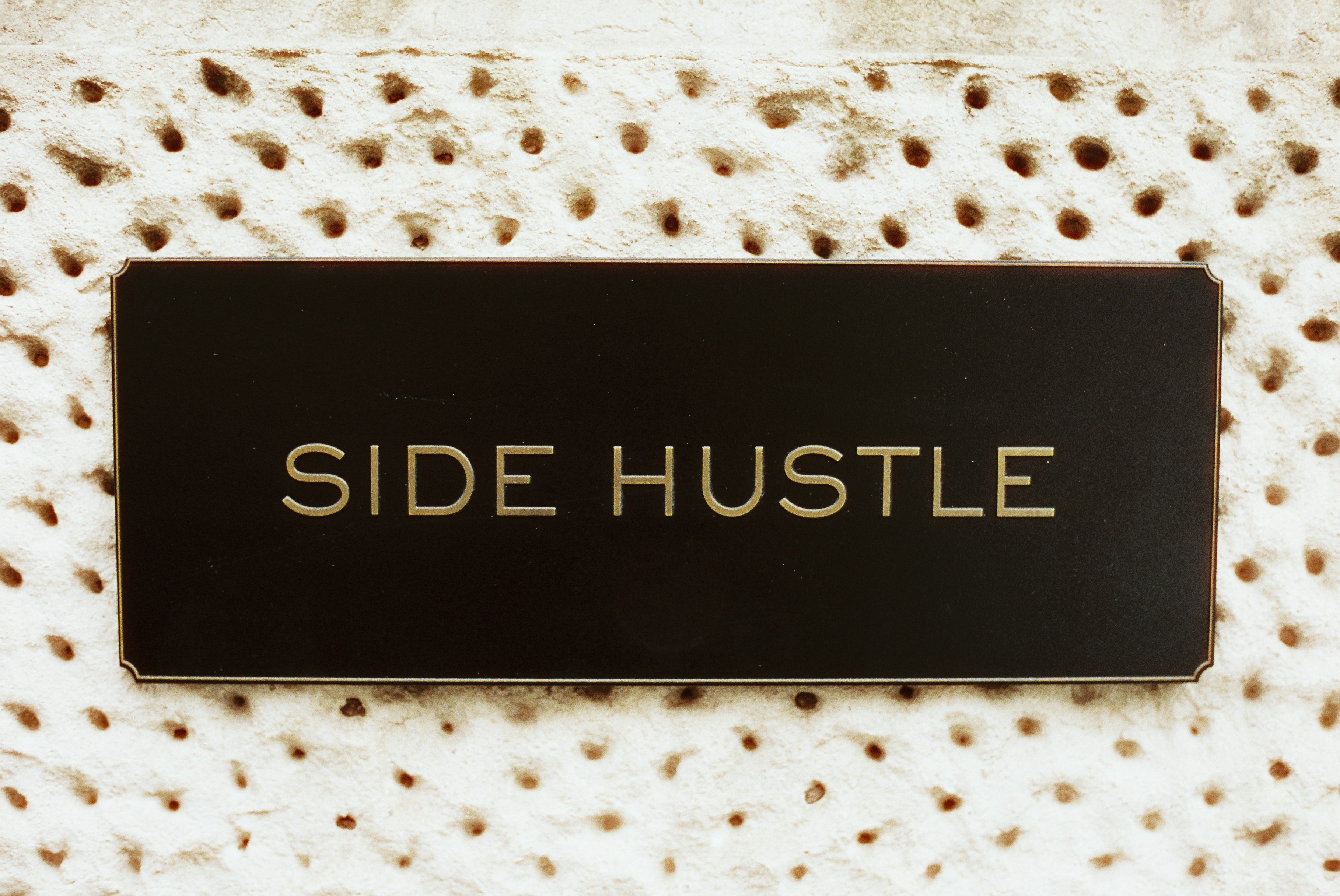 ide hustle text displayed on a brown background.